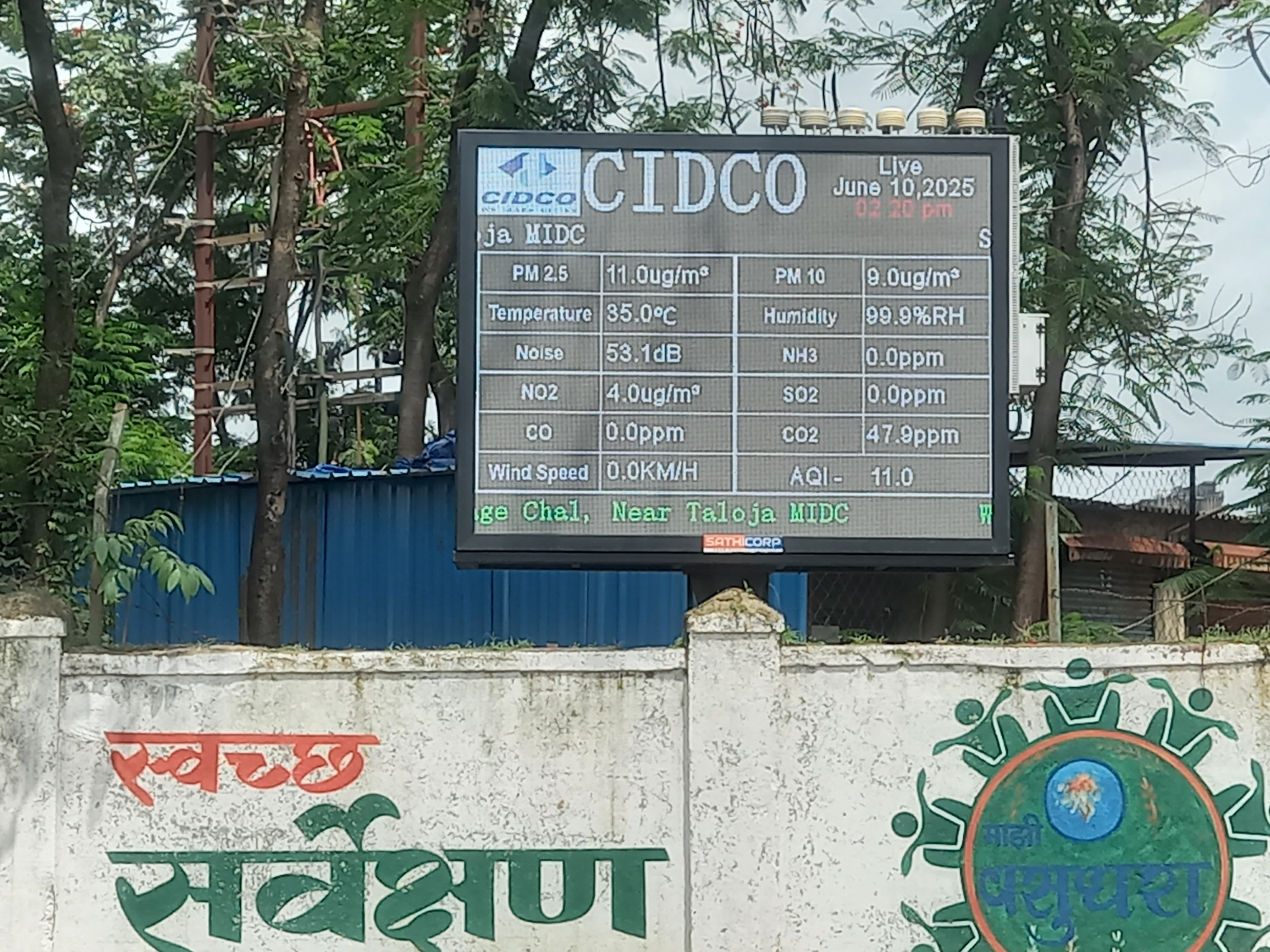 Close-up of CIDCO AQMS LED display showing real-time air quality data